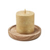 Candle on round wooden base